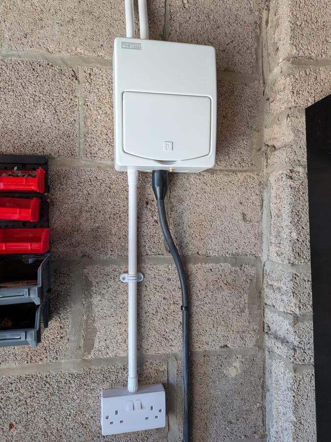 Outdoor weatherproof consumer unit and double socket installation at a domestic property in South Wales